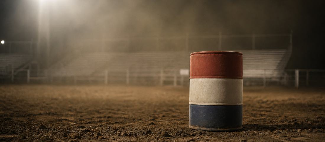 A padded barrel standing alone in an empty floodlit arena