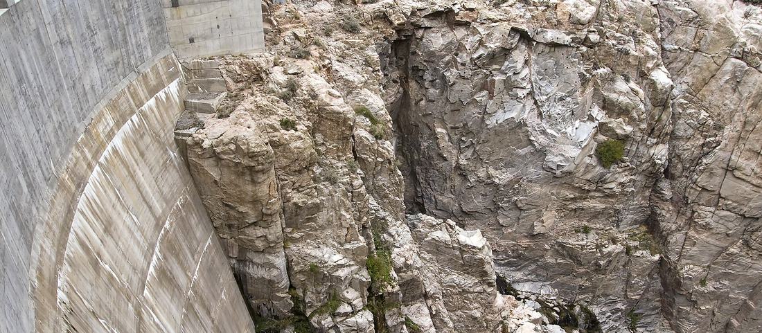 Buffalo Bill Dam wedged into the narrow granite walls of Shoshone Canyon