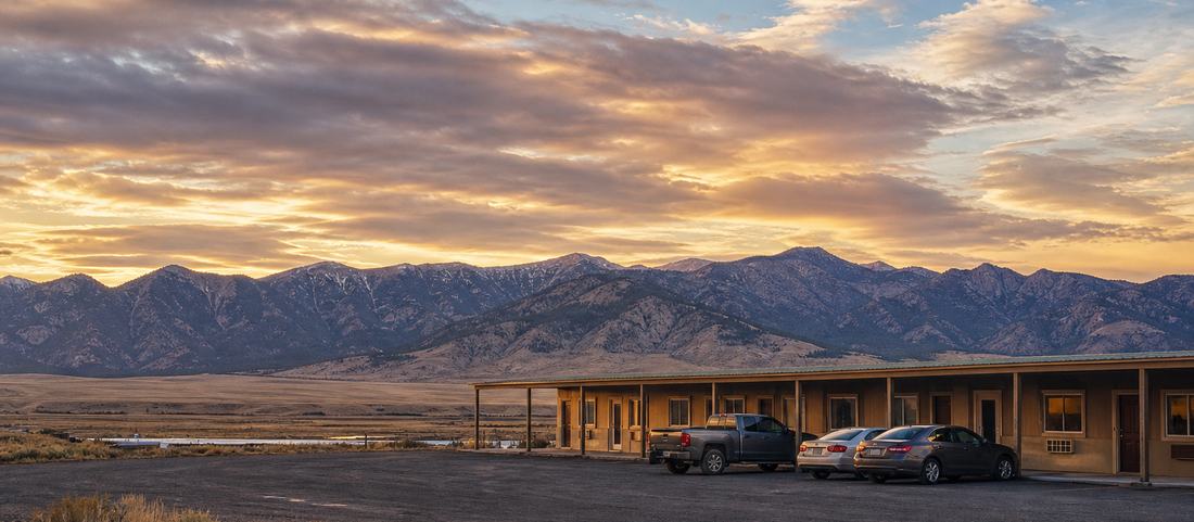 A low roadside motel on the edge of a Wyoming town beneath the mountain front